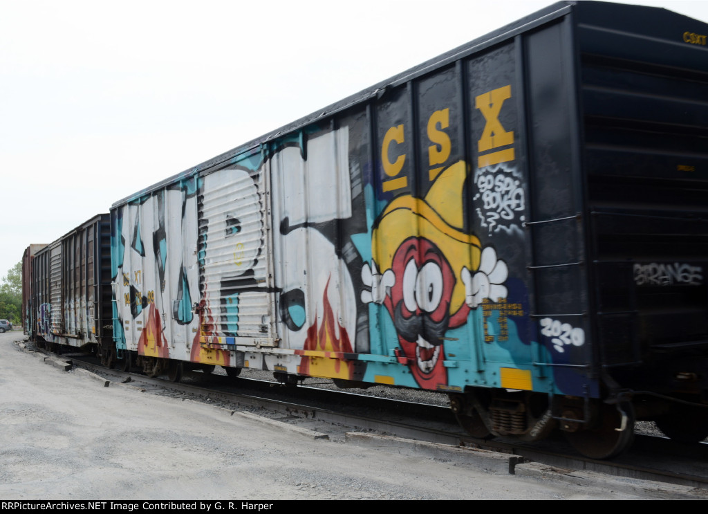 Fully tagged boxcar being taken away on NS yard job E19